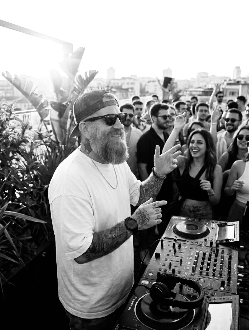 SW3NTON DJing a rooftop party in black and white